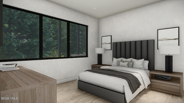 bedroom with hardwood / wood-style flooring