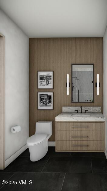 bathroom featuring baseboards, vanity, toilet, and tile patterned floors