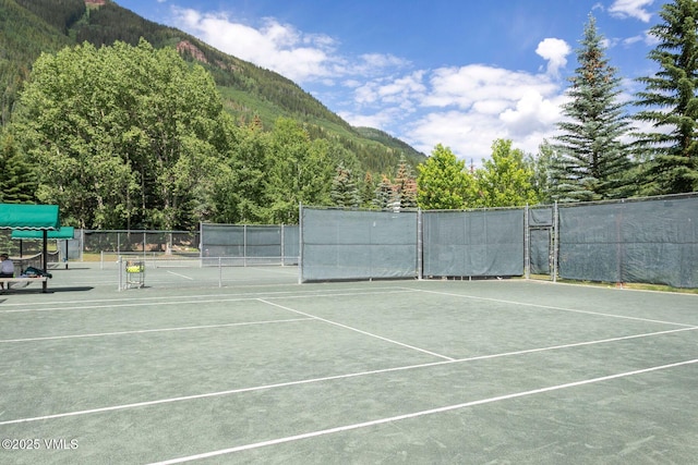 4610 Vail Racquet Club Dr Unit 2, Vail, CO 81657 - view of tennis court with a mountain view and a view of trees