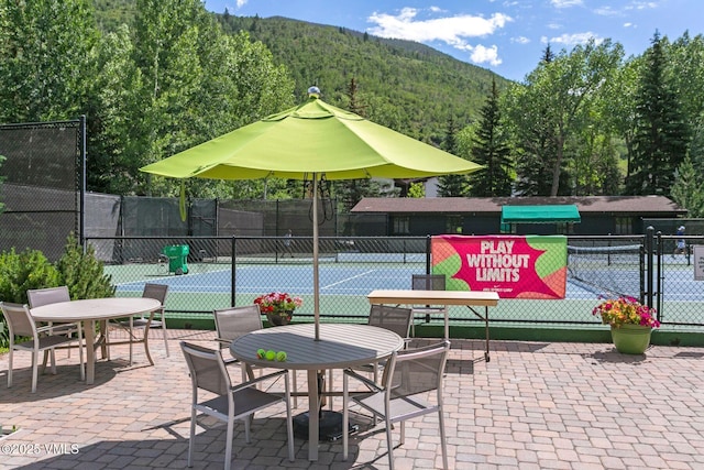 4610 Vail Racquet Club Dr Unit 2, Vail, CO 81657 - view of tennis court featuring a view of trees and a mountain view