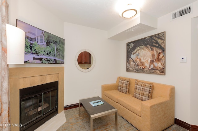 26 Avondale Ln Unit 409-H, Beaver Creek, CO 81620 - living area featuring baseboards and a tile fireplace