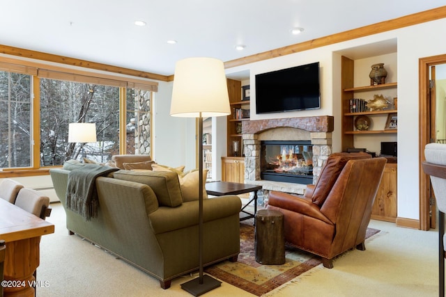 living room with a baseboard radiator, a stone fireplace, light carpet, and built in shelves