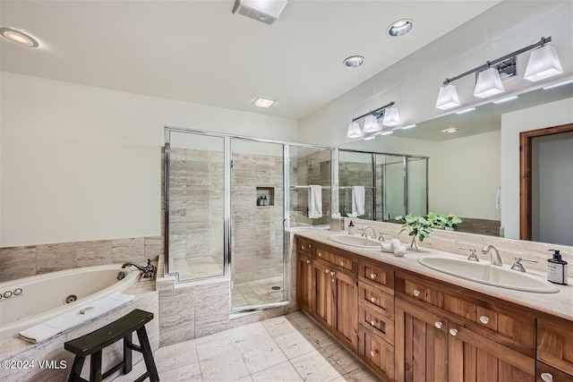 bathroom with vanity and separate shower and tub