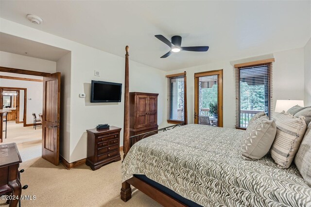 carpeted bedroom with lofted ceiling and ceiling fan