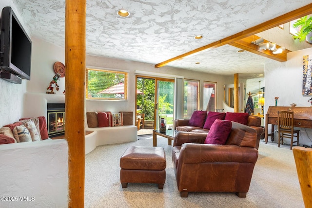 20 Hereford Rd, Edwards, CO 81632 - living area with carpet flooring, a fireplace, and beam ceiling