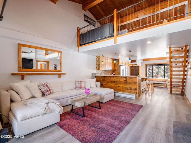 living room with high vaulted ceiling, wooden ceiling, wood finished floors, and beam ceiling