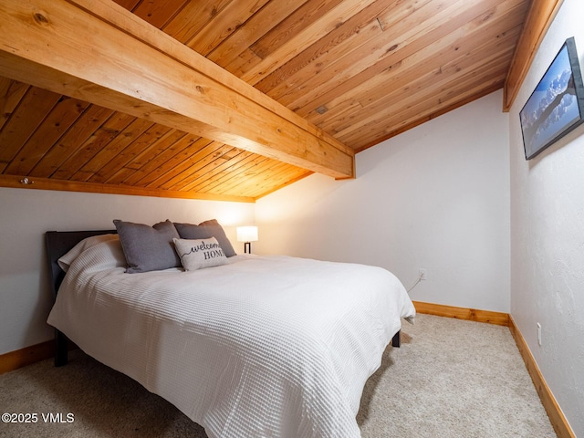 bedroom with vaulted ceiling with beams, wooden ceiling, carpet, and baseboards