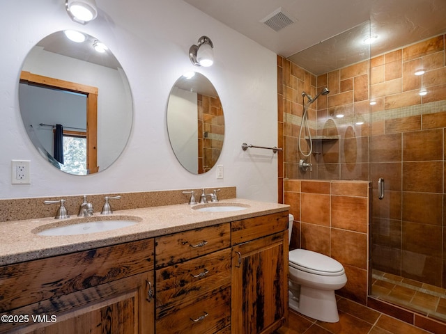 full bathroom with visible vents, a sink, and a shower stall