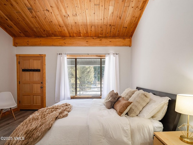 bedroom featuring lofted ceiling, wood finished floors, and wood ceiling