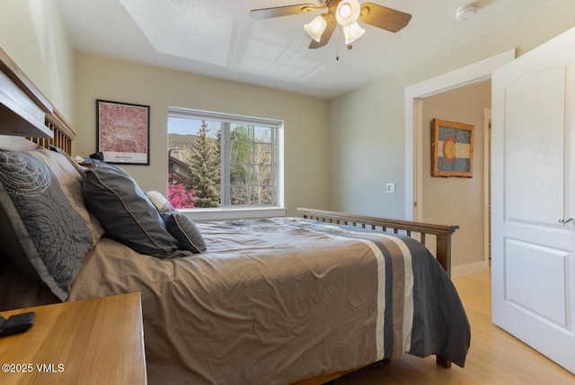 1303 Crazy Horse Cir Unit 1303, Edwards, CO 81632 - bedroom with light wood-style flooring and a ceiling fan