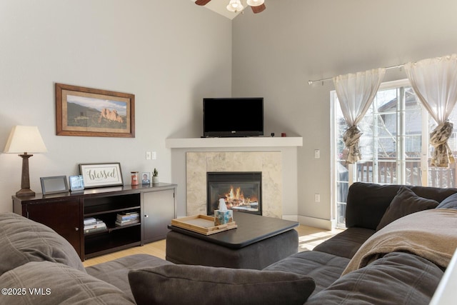 1303 Crazy Horse Cir Unit 1303, Edwards, CO 81632 - living room with high vaulted ceiling, a ceiling fan, and a premium fireplace