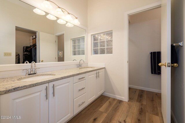 bathroom featuring vanity and hardwood / wood-style flooring