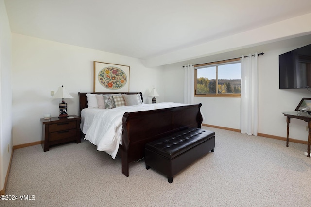 bedroom featuring light carpet