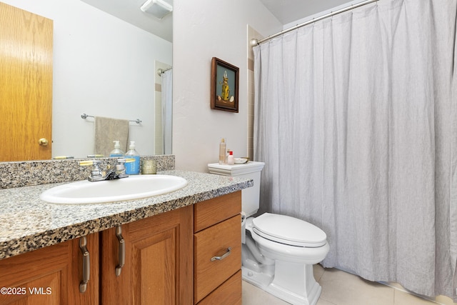 bathroom with tile patterned flooring, visible vents, vanity, and toilet