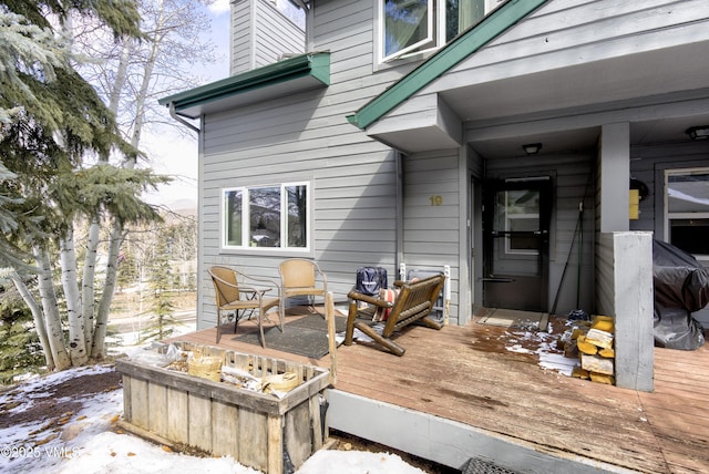 view of snow covered deck