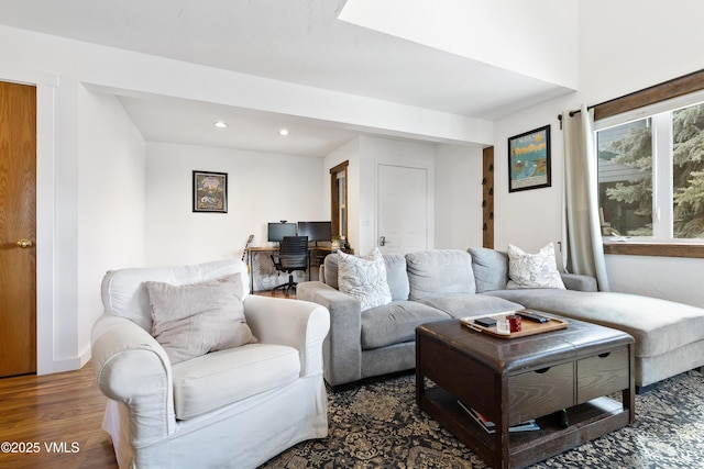 living room with wood finished floors and recessed lighting