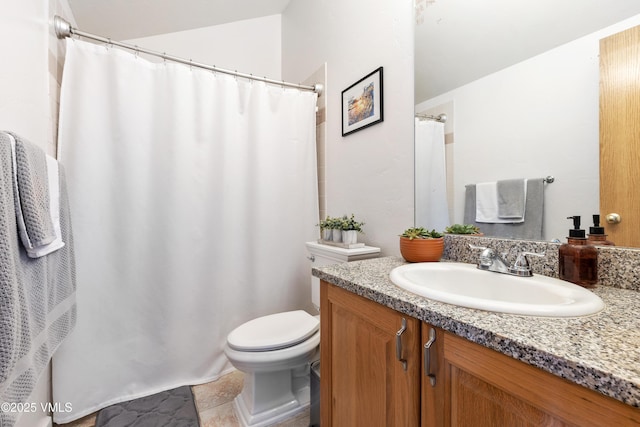 bathroom featuring toilet, a shower with curtain, and vanity