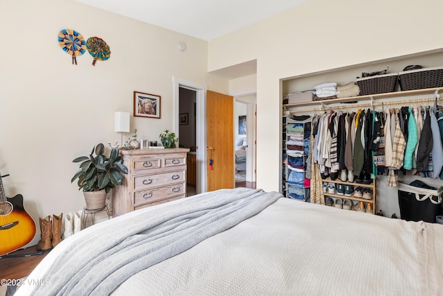 bedroom featuring a closet and wood finished floors