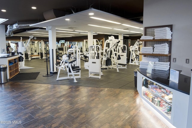 workout area with wood finished floors