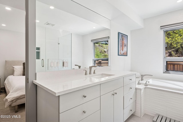 1650 Fallridge Rd Unit 120, Vail, CO 81657 - bathroom with vanity, healthy amount of natural light, a garden tub, radiator, and recessed lighting