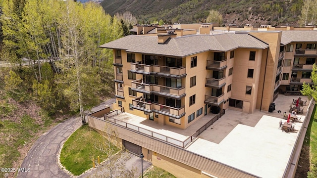 1650 Fallridge Rd Unit 120, Vail, CO 81657 - view of building exterior with a mountain view and a forest view