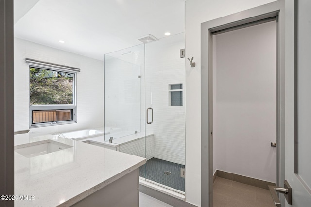 1650 Fallridge Rd Unit 120, Vail, CO 81657 - bathroom featuring a shower stall, recessed lighting, vanity, tile patterned floors, and a tub to relax in