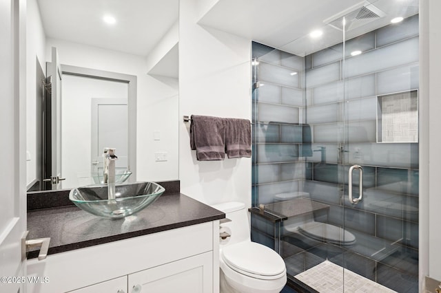1650 Fallridge Rd Unit 120, Vail, CO 81657 - full bathroom featuring toilet, vanity, and a stall shower