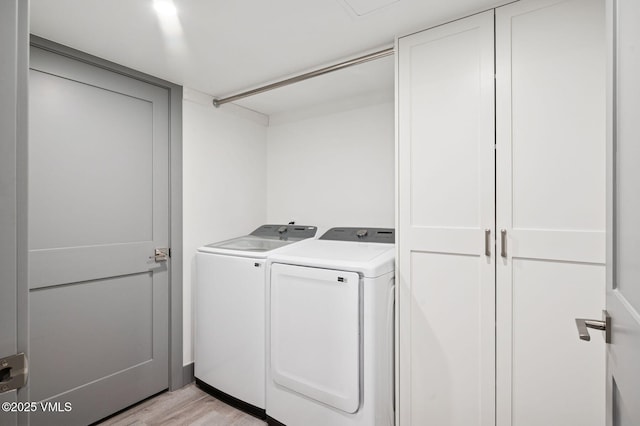 1650 Fallridge Rd Unit 120, Vail, CO 81657 - laundry area featuring washing machine and dryer and light wood-style flooring