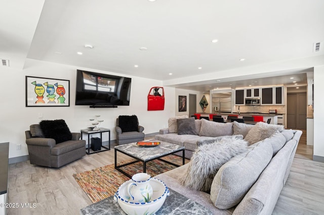 1650 Fallridge Rd Unit 120, Vail, CO 81657 - living area with light wood finished floors, recessed lighting, and baseboards