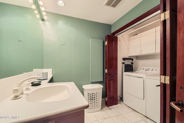 1234 Westhaven Cir Unit A-71, Vail, CO 81657 - bathroom with washing machine and dryer, marble finish floors, vanity, and recessed lighting