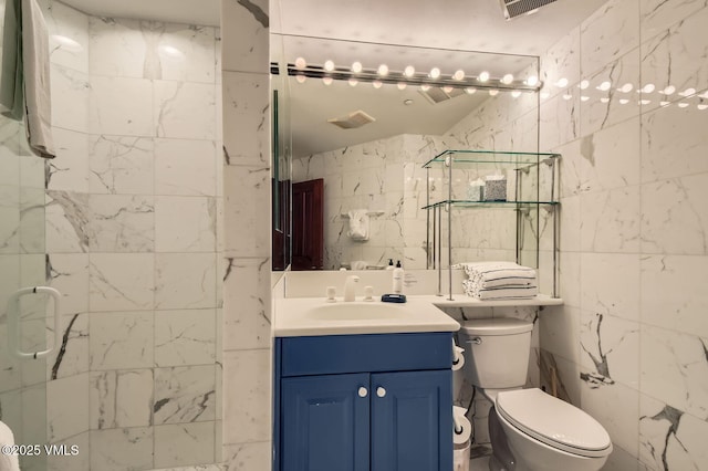 1234 Westhaven Cir Unit A-71, Vail, CO 81657 - full bathroom with vanity, a stall shower, toilet, and tile walls