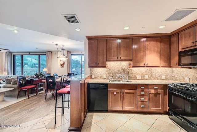1234 Westhaven Cir Unit A-71, Vail, CO 81657 - kitchen with black appliances, a sink, backsplash, light stone counters, and open floor plan
