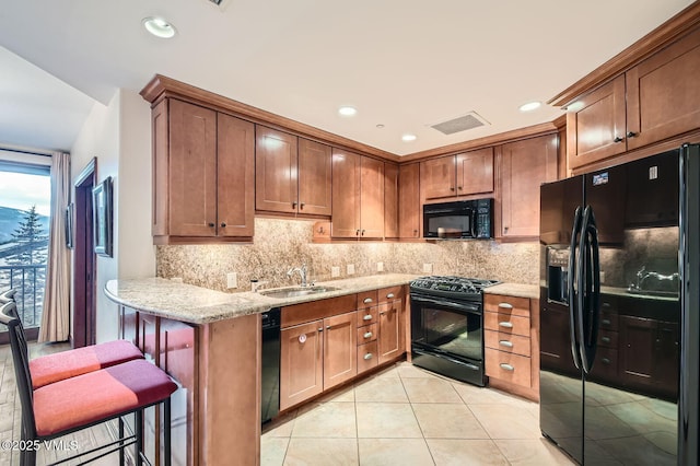 1234 Westhaven Cir Unit A-71, Vail, CO 81657 - kitchen featuring black appliances, a sink, backsplash, light stone counters, and recessed lighting