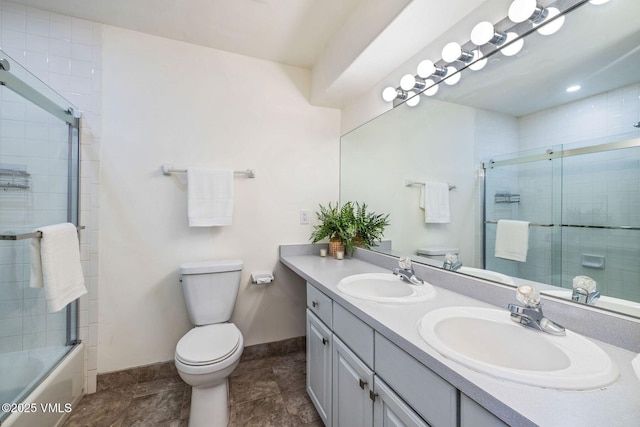 210 June Creek Rd Unit A, Edwards, CO 81632 - bathroom with double vanity, baseboards, toilet, and enclosed tub / shower combo