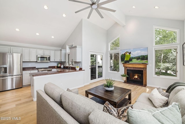 210 June Creek Rd Unit A, Edwards, CO 81632 - living area with high vaulted ceiling, ceiling fan, light wood-type flooring, plenty of natural light, and recessed lighting