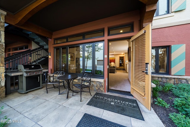 660 Lionshead Pl Unit 9, Vail, CO 81657 - property entrance featuring a patio area and stone siding