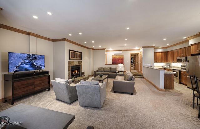 660 Lionshead Pl Unit 9, Vail, CO 81657 - living room with ornamental molding, light carpet, a tile fireplace, recessed lighting, and baseboards