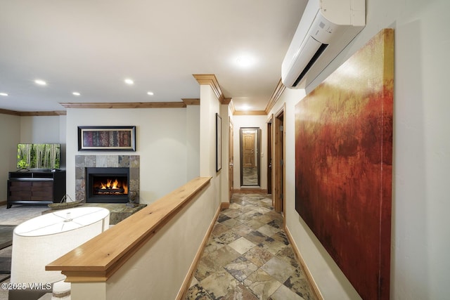 660 Lionshead Pl Unit 9, Vail, CO 81657 - hallway featuring ornamental molding, baseboards, an AC wall unit, light stone finish floors, and recessed lighting
