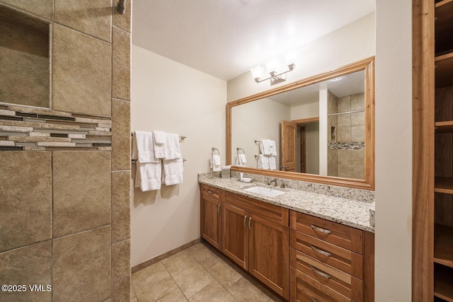 660 Lionshead Pl Unit 9, Vail, CO 81657 - bathroom featuring vanity, baseboards, and tile patterned floors