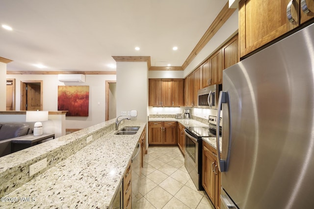 660 Lionshead Pl Unit 9, Vail, CO 81657 - kitchen featuring appliances with stainless steel finishes, a wall mounted air conditioner, a sink, ornamental molding, and brown cabinetry