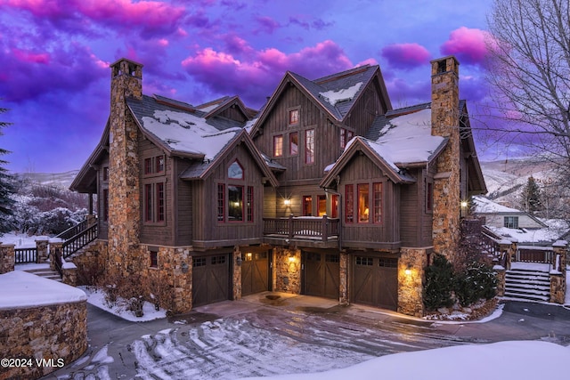 view of front of home featuring a garage and a mountain view