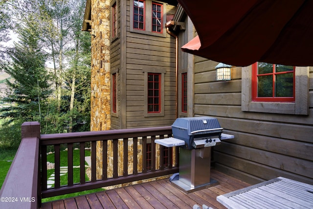 wooden deck featuring grilling area