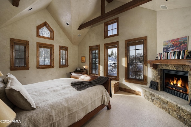 bedroom with a fireplace, beam ceiling, carpet floors, and high vaulted ceiling