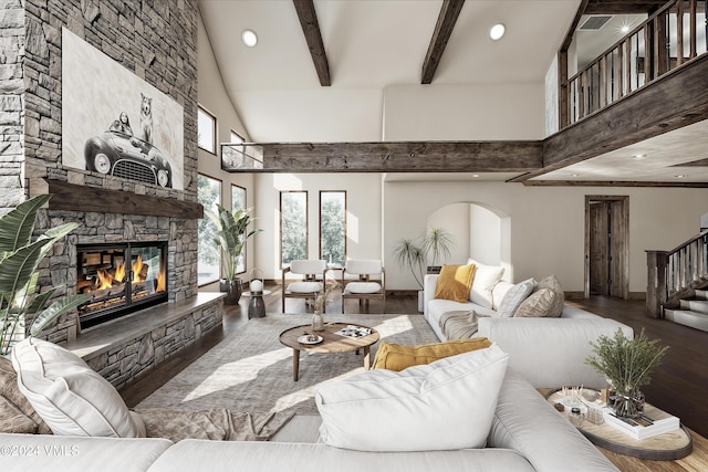 living room featuring beamed ceiling, wood-type flooring, a towering ceiling, and a fireplace