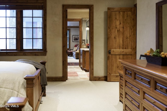 bedroom with light colored carpet