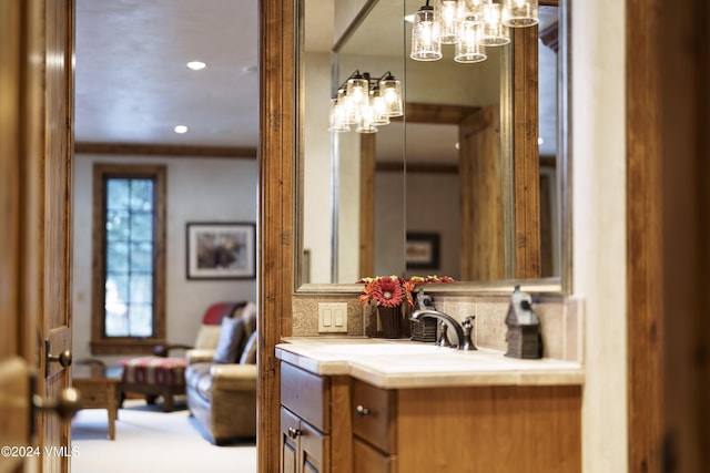 bathroom featuring vanity and decorative backsplash