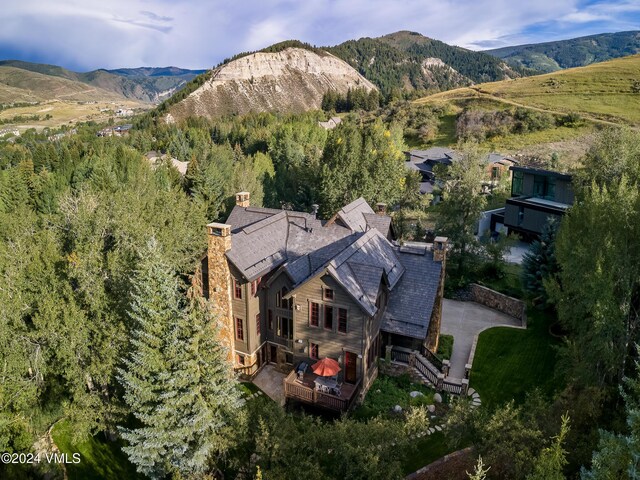 birds eye view of property with a mountain view