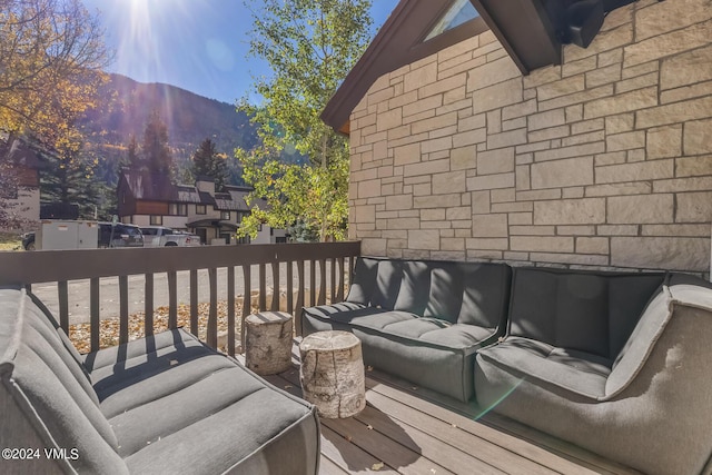 wooden deck featuring a mountain view