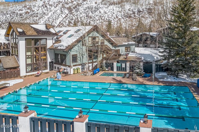 view of snow covered pool