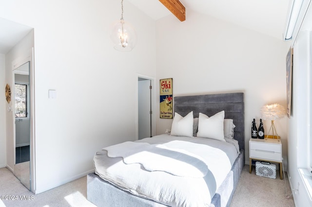 carpeted bedroom with beam ceiling and high vaulted ceiling